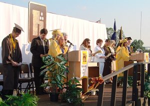 The class officers lead the singing of the Alma Mater.